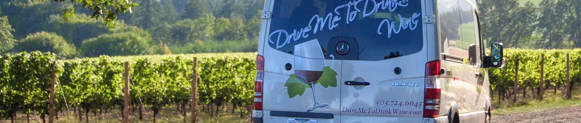 Drive Me To Drink Wine van on a vineyard road during a private Willamette Valley wine tour.